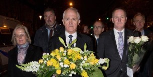 John Key with New Zealand's floral tribute in honour of the innocents slaughtered in Paris on 18 November