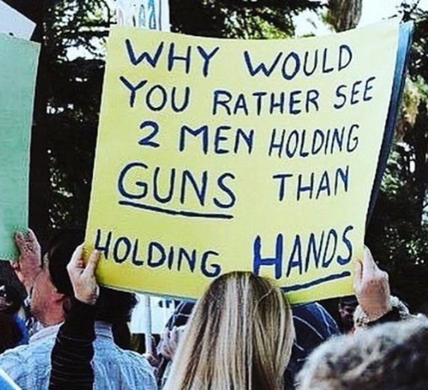 Rather see two men holding guns than holding hands