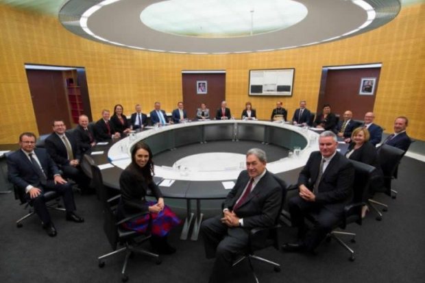 Labour and New Zealand First Ministers under the first term of the sixth Labour government sitting in the Cabinet office.